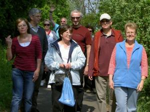 The intrepid travellers stepping out at a brisk pace through Hodson Woods.